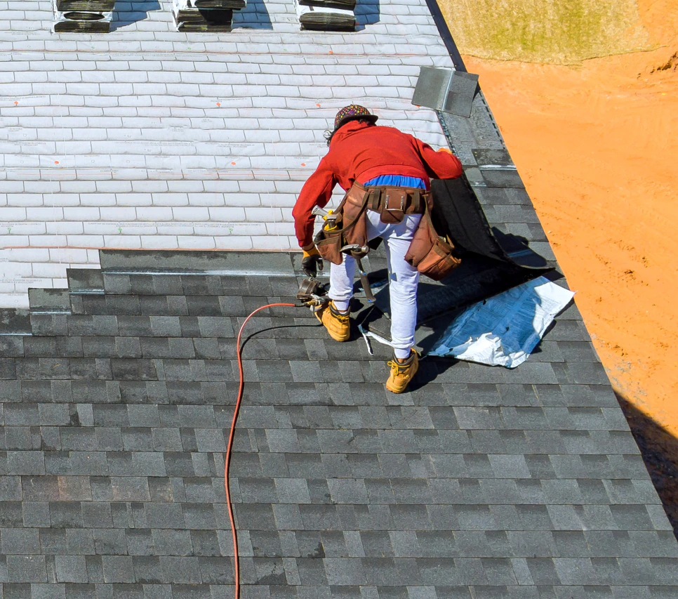 man using hammer to fix a roofing 1