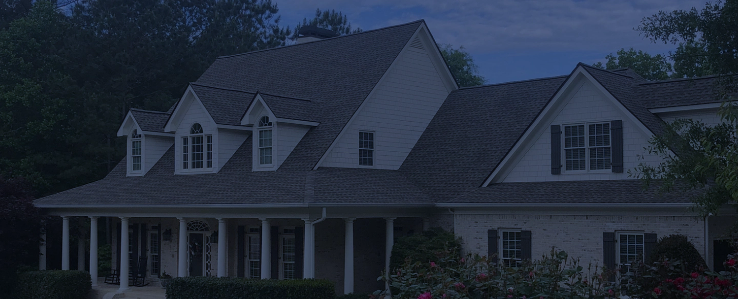 white house with a beautiful roofing monroe ga