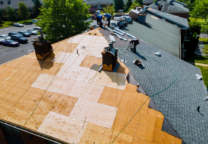 workers installing new roofing monroe ga